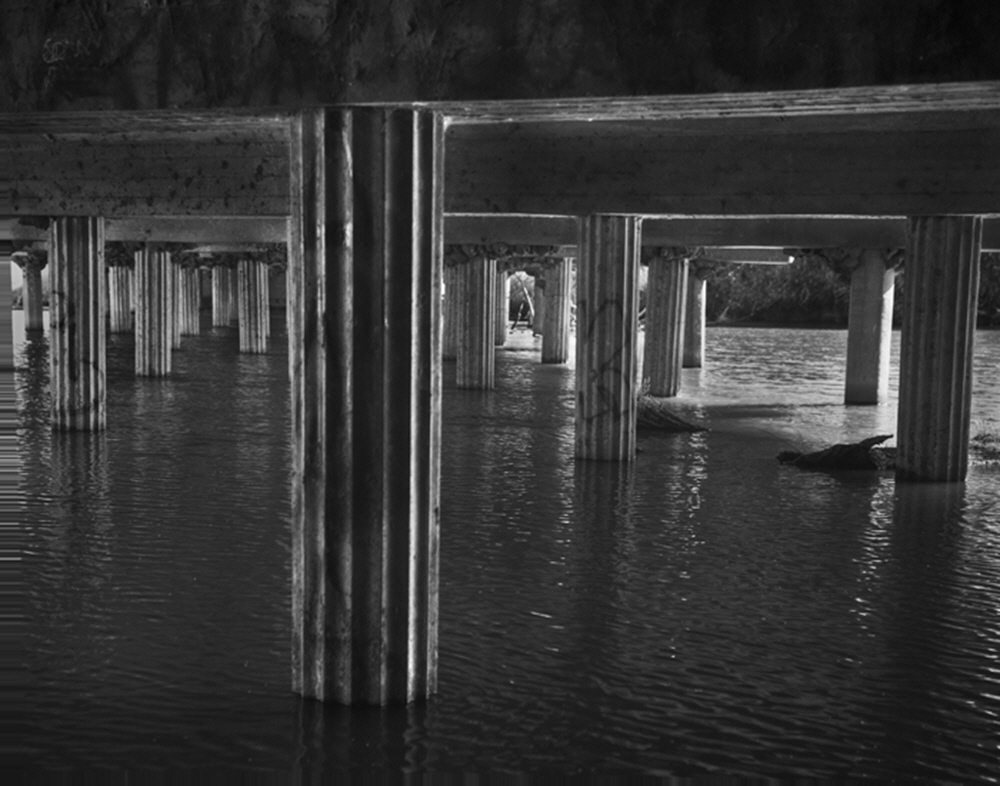 Ornate pilings beneath the Highway 41 Bridge at the natural rivers end, shows the attention to detail of a bygone era.