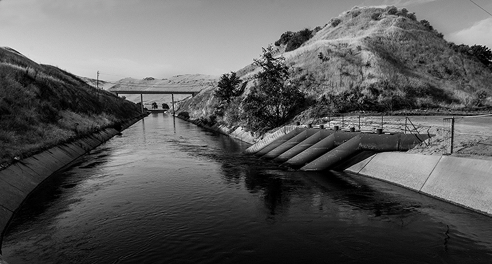 Hugh tubes, abandoned today, which were  used to pump water from one system, under the Kings River and then south running Friant Kern Canal.