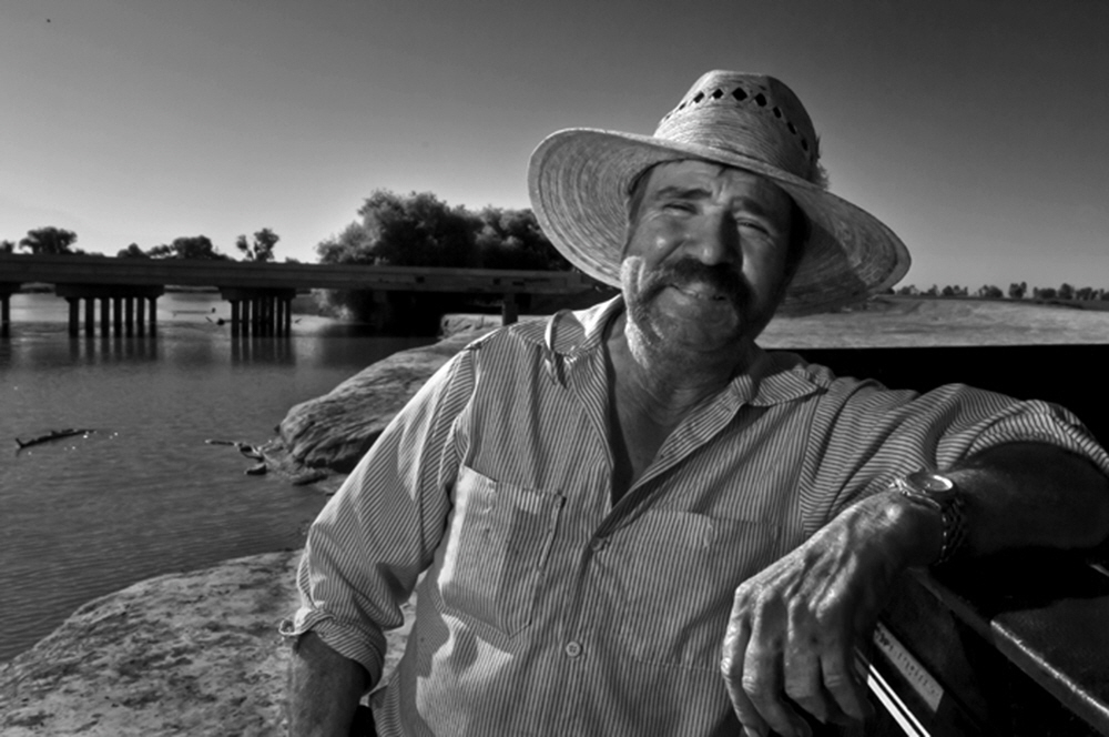 Jesus Garcia routinely fishes the control gates at the natural rivers end in Stratford, Ca.